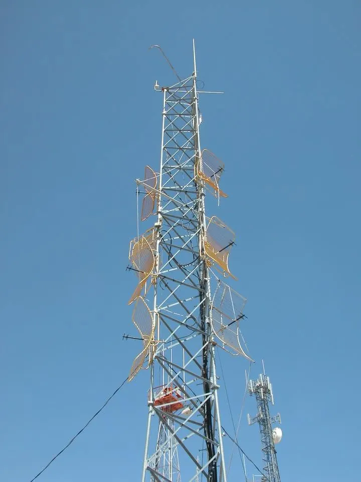 Translator antenna panels mounted on a tower against a clear sky